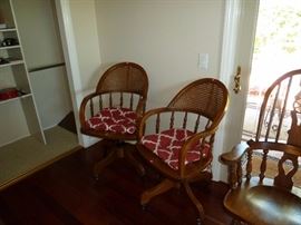 Two chairs that swivel