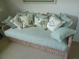 cute wicker couch with the pillows