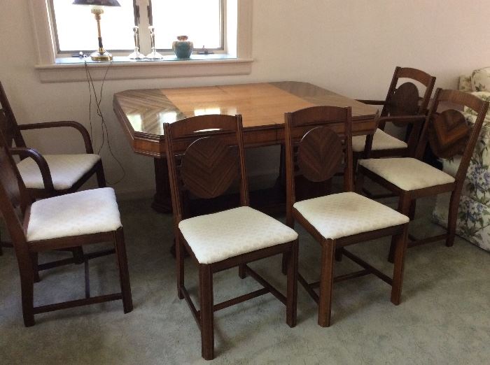 All wood 1930's dining table and matching chairs.