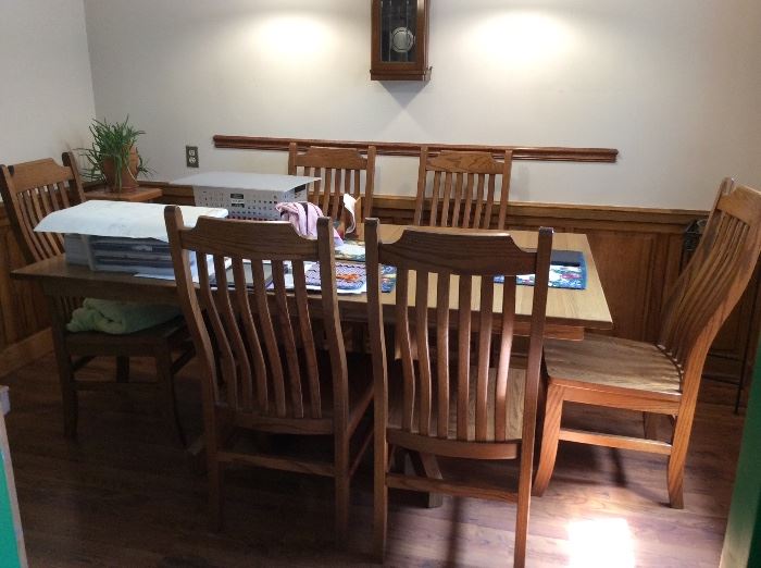 Oak arts and crafts style dining table and chairs.