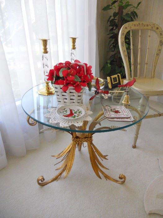 Ornate brass base occasional table with glass top