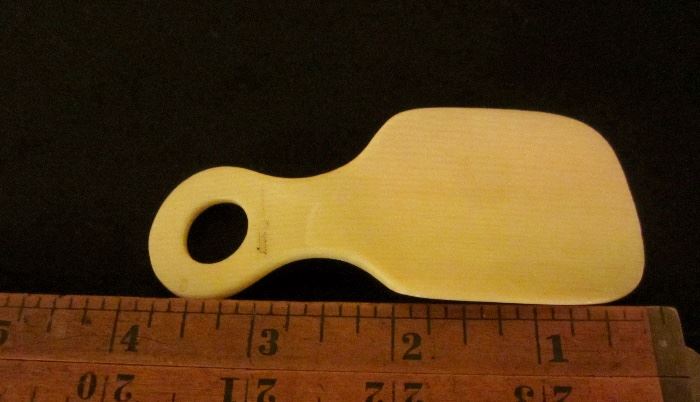 Shoe horn with "Ivory" imprinted on handle