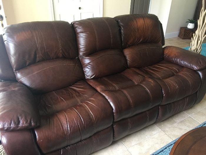 Brown leather love seat and sofa