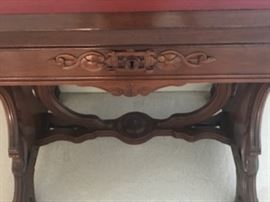 ANTIQUE HAND-CARVED SIDE TABLE WITH RED LEATHER TOP