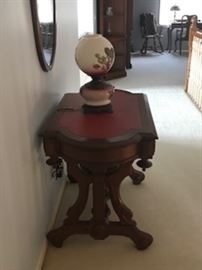 ANTIQUE HAND-CARVED SIDE TABLE WITH RED LEATHER TOP