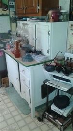 very vintage kitchen storage, with gas lamps