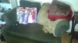 over stuffed chair with matching ottoman that holds extra storage