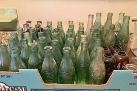 Vintage Coke and Pepsi bottles