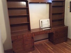 Ethan Allen chest/hutch/bookshelf. Or wall unit with vanity in the middle with mirror.