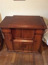 Antique Singer sewing machine and parlor cabinet