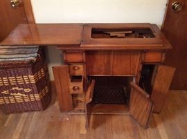 Antique Singer sewing machine and parlor cabinet