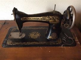 Antique Singer sewing machine and parlor cabinet