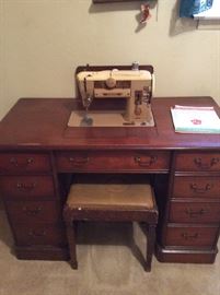 Singer sewing machine in cabinet