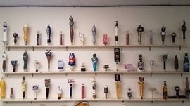 large collection of beer tap handles