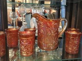 Beautiful Iridescent Carnival Glass
   1 Pitcher
   7 Tumblers
