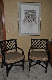 Two black painted bamboo arm chairs with detachable striped cushions.  23"W x 34"H x 22"D