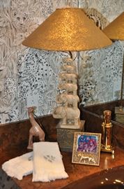 Fantastic jungle decor including  a Berebi tiger frame (even in the powder room!)