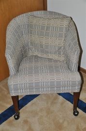 Vintage upholstered barrel chair on casters.  23.5"W x 29"H x 27"D  (2 available)