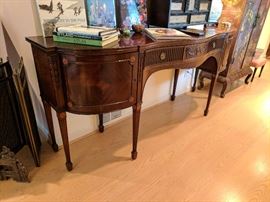 Hepplewhite side board, reeded legs, spade feet, center drawer between two cabinet doors, rosette inlays. 84" x 24.75" 