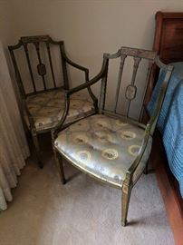Pair George III Sheraton-style painted green 'elbow' chairs; silk jacquard upholstery.
