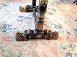 Black lacquer 'Japanned' sewing table with gilt floral scrolling, paw feet.

