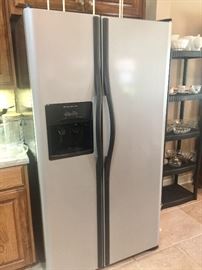 Refrigerator freezer with ice maker on door
