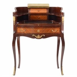 French Style Ladies Desk: A French, Louis XV style ladies desk, veneered in mahogany and satinwood. The curvilinear, finished back, wraps around a centered marble shelf with brass gallery, over two string inlaid drawers and an embossed leather, pull-out writing surface. Below is one inlaid drawer, between cabriole legs with ormolu mounts. Mid 20th century.