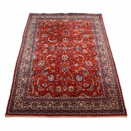 Hand Knotted Persian Inspired Area Rug: A hand knotted Persian rug. The rug features and allover floral design with shades of red. blue. green, tan and golden yellow. It has a kilim shirt and overcast selvage edges.