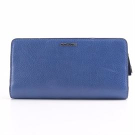 Coach Madison Skinny Wallet: A Coach Madison Skinny Wallet. The woman’s wallet is style 50233. The wallet is all leather and is lacquer blue.