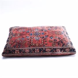 Persian Wool Rug Dog Bed: Persian wool rug dog bed. The bed is rectangular with four corners and a velvet backing.