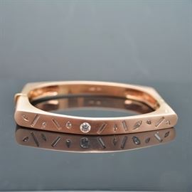 Raul Haas 14K Rose Gold 0.92 CTW Diamond Bracelet: A 14K rose gold 0.92 ctw diamond bracelet designed by Raul Haas. This squared bangle style bracelet features flush set diamonds in round brilliant cut, straight baguette, marquise and pear shapes, with a box tab and hinge closure.