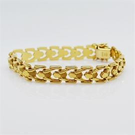 Aurafin 14K Yellow Gold Link Bracelet: A 14K yellow gold link bracelet by Aurafin. Made in Italy, this bracelet features a polished and textured repeating link design.