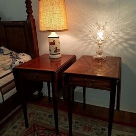 Mahogany finish tables with drop leaves.  Lamp on the right signed Waterford