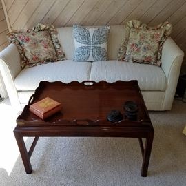 Mahogany finish coffee table in front of a Stearns and Foster Sleeper/Sofa.