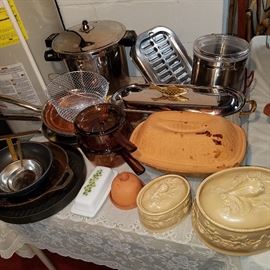 Fish pan (chrome color behind terra cotta baker) is by Spring of Switzerland, as ar the small pans to the far left, and numerous other pieces in this sale.  