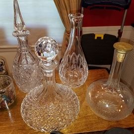 Back left decanter is signed Libbey Brilliant period cut glass (no-show damage to bottom of stopper).  Front left decanter is a Waterford ship's decanter