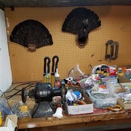 Workbench in basement.  Turkey feather plaques on the wall from Europe