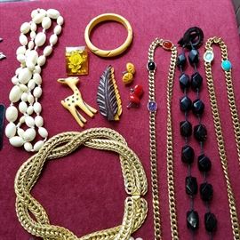 Bakelite fawn & leaf pins, earrings & bangle.  Other costume jewelry.  Black beads part of the Gerda Lynggaard ""Rosary" necklace made of horn
