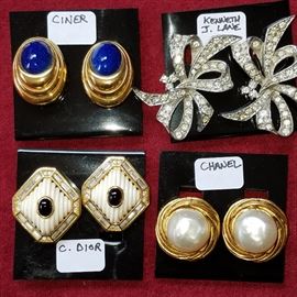 Some of the previously pictured earrings showing maker/designer