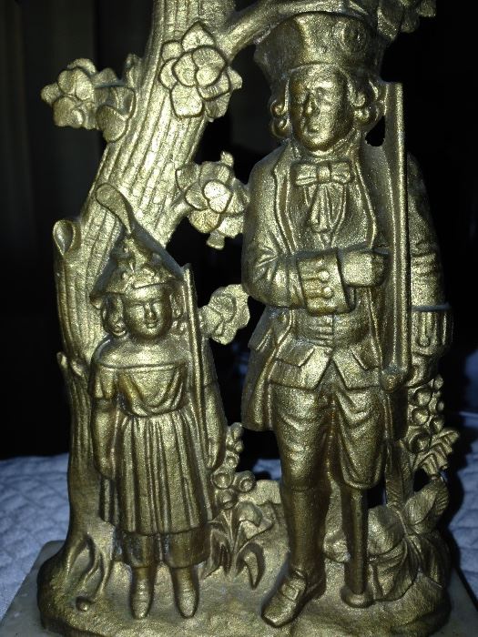 Here is a great picture of the brass figures in the brass (or ormolu) and crystal candle sticks. 