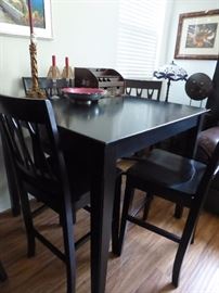 one of two tall table and chairs sets