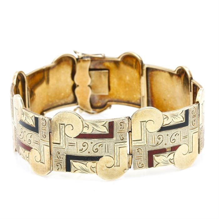 14K Yellow Gold Enamel Accent Bracelet: A 14K yellow gold bracelet with red and black enamel accents. This bracelet is made from links with etched abstract, geometric designs.