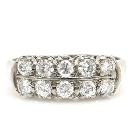 14K White Gold 0.98 CTW Diamond Ring: A 14K white gold 0.98 ctw diamond ring. This ring features two rows of prong set diamond center stones with plain shoulders on either side of the center.