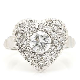 14K White Gold 1.21 CTW Diamond Heart Ring: A 14K white gold 1.21 ctw diamond heart ring. This ring features a heart shaped center filled with twenty five diamonds.