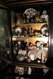 Drexel Display Cabinet - Asian Style
Black painted with fine gold-toned inlay and accents. 2 glass cabinet doors with decorative metal pulls open to reveal 3 adjustable height glass shelves. Bottom doors open to reveal 1 adjustable height shelf. Overall very good condition.
80"tall x 31"wide x 14 3/4"deep