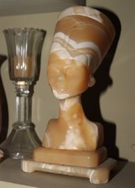 Vintage Alabaster Egyptian Bust
Egyptian Queen, perhaps Nefertiti. We believe it to be made of alabaster. Has an orange-tint. Total height on base is 11 1/2"tall. Bottom of base is 6"wide x 4"deep. Top of bust opens to reveal hollow interior of head. Beautifully made. Overall very good condition.