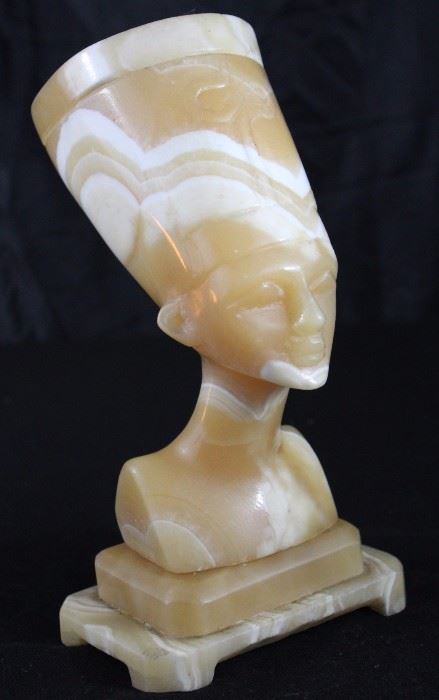 Vintage Alabaster Egyptian Bust

Egyptian Queen, perhaps Nefertiti. We believe it to be made of alabaster. Has an orange-tint. Total height on base is 11 1/2"tall. Bottom of base is 6"wide x 4"deep. Top of bust opens to reveal hollow interior of head. Beautifully made. Overall very good condition. 