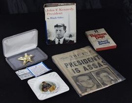 John F. Kennedy Collectibles Group
Featuring a November 22, 1963 copy of the Evening Sun with the headline "President Kennedy is Assassinated" in plastic wrap. Appears to be well-kept.
President & Mrs. John F Kennedy Cape Cod, Mass. Ash Tray
"13 Days Memoir of the Cuban Missle Crisis" 1969. Second Printing.
"John F. Kennedy, President" by Hugh Sidey hardback w/ dust jacket. New edition. Book Club Edition. Copyright 1964.
Star brooch. Certified, "same design as the one worn by Jacqueline Kennedy Onassis."