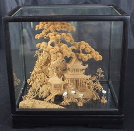 Vintage Intricate Carved Scene in Display Case
Appears to be carved from cork. Very detailed, very fragile. Features Asian-style house, gazebo, and bridge w/ foliage and bird-life.
Glass-case lifts off of wood base. Entire case measures 11"tall x 11"wide x 7"deep.
Overall good condition.