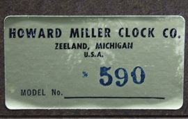 Howard Miller Model 590 Mid-Century Wall Clock
Clock is in a wood frame with 3 shelves for magazines or documents. Sticker on back read "Howard Miller Clock Co. Zeeland Michigan. Model No 590" Overall very good condition. Scrapes on back of unit. Tested and working.
Measures 42"tall x 14"wide x 4 1/2"deep